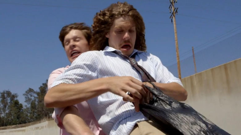 Blake sits on Anders' lap on bike