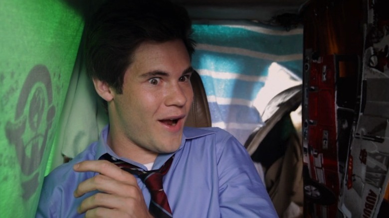 Adam wild-eyed in car