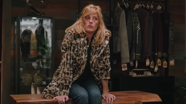 Beth Dutton sitting on a store counter on Yellowstone