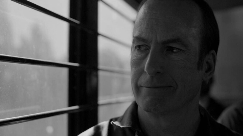 Jimmy smiling on a prison bus in "Saul Gone"