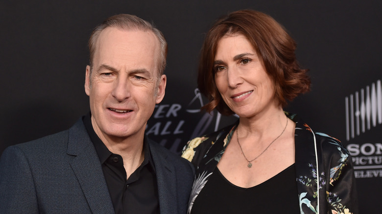 Bob and Naomi Odenkirk smiling for cameras.