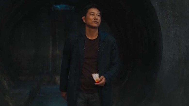 Han walks into a room holding snacks 