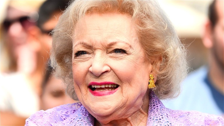 Betty White posing for photographers