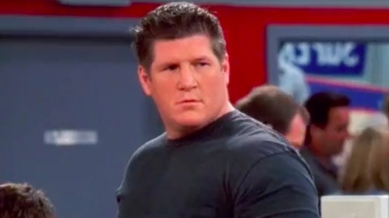 Brian Turk looking over shoulder in "Two and a Half Men"