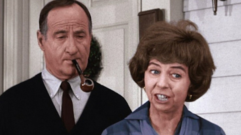 George Tobias smokes pipe