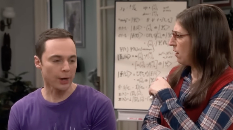 Jim Parsons and Mayim Bialik with a whiteboard