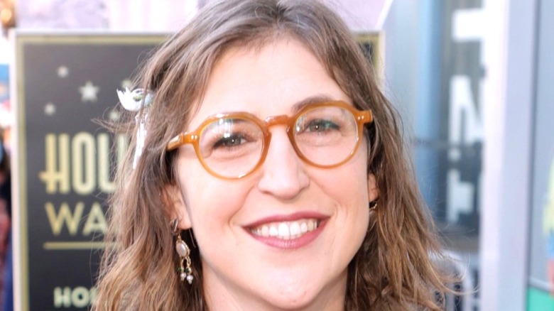 Bespectacled Mayim Bialik smiling