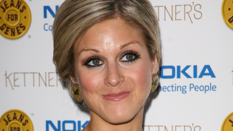 Nikki Grahame close-mouthed smile