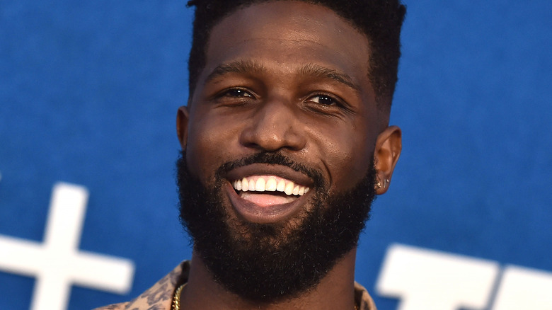 Brandon Kyle Goodman smiling on red carpet