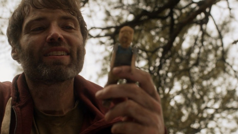 Seth Gabel happily giving a gift