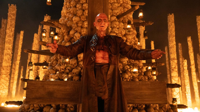 Dr. Kelson stands before an altar in "28 Years Later: The Bone Temple" (2026)