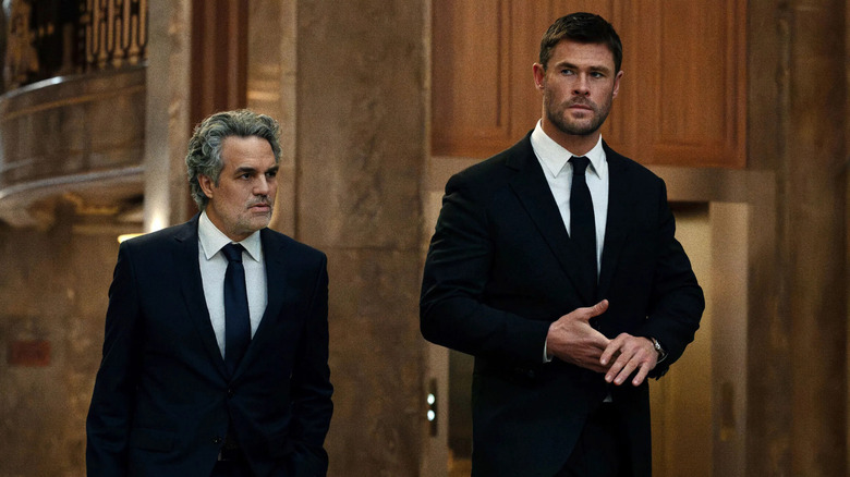 Mike and Lou walk and talk in "Crime 101" (2026)