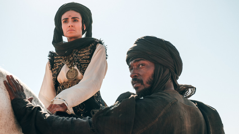 Hanzala and Princess Hind look into the distance in "Desert Warrior" (2026)