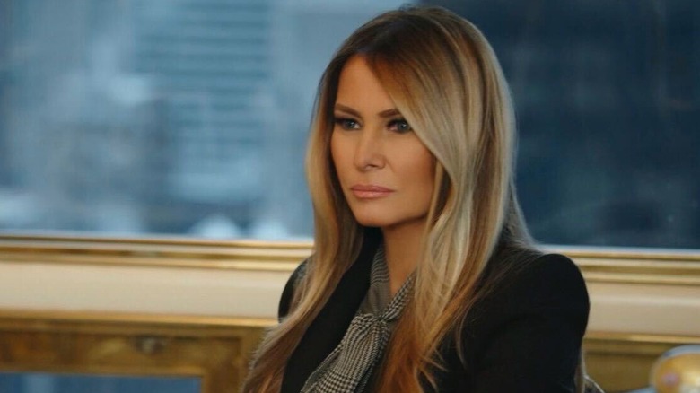 Melania Trump sits behind her desk in "Melania" (2026)