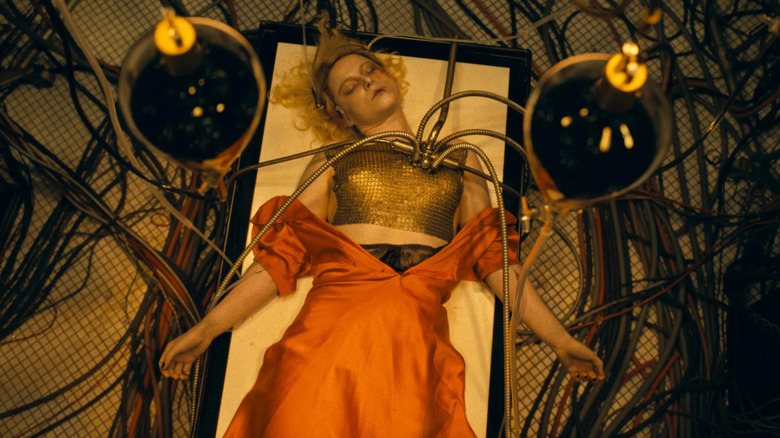 Ida gets zapped on a lab table in "The Bride!" (2026)