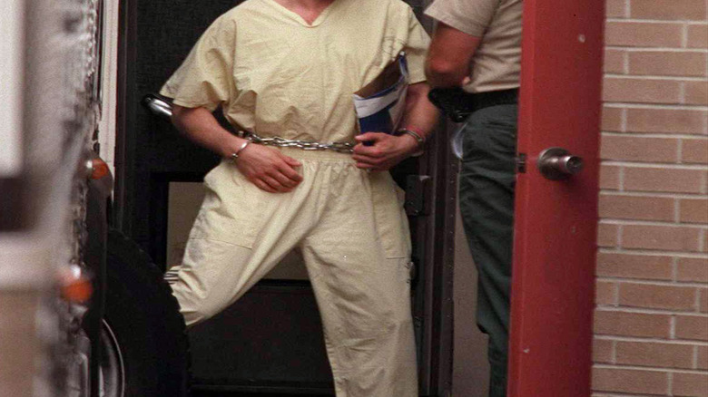 Downey in cuffs in court
