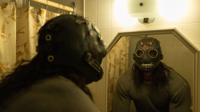 The titular murderer looking in the mirror in "Psycho Killer" (2026)