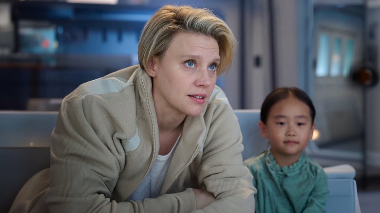 Coakley leaning forward in "In the Blink of an Eye" (2026)