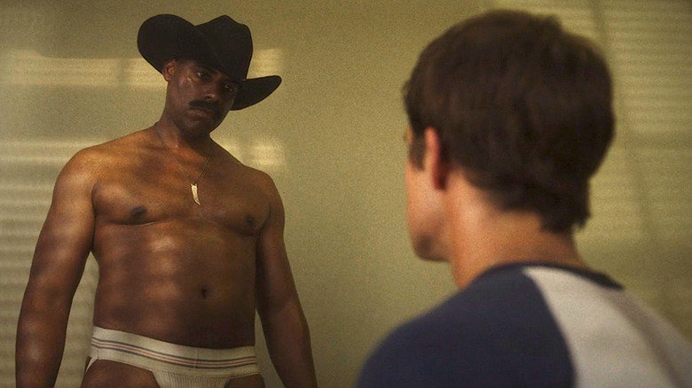 Handsome half-naked cowboy glares