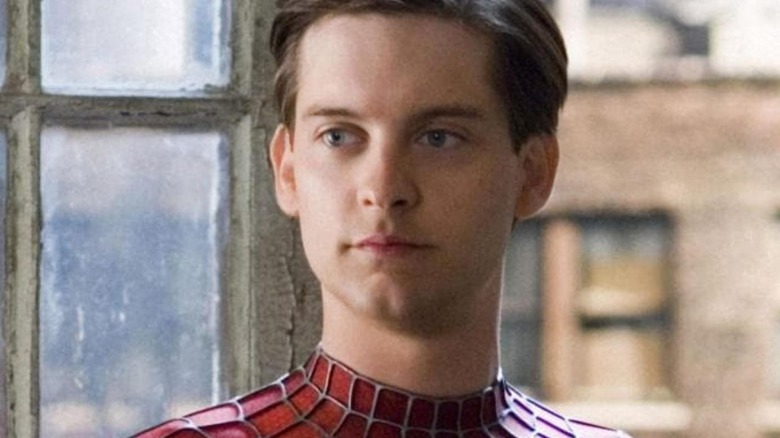 A close-up of Tobey Maguire as Peter Parker unmasked in Spider-Man suit