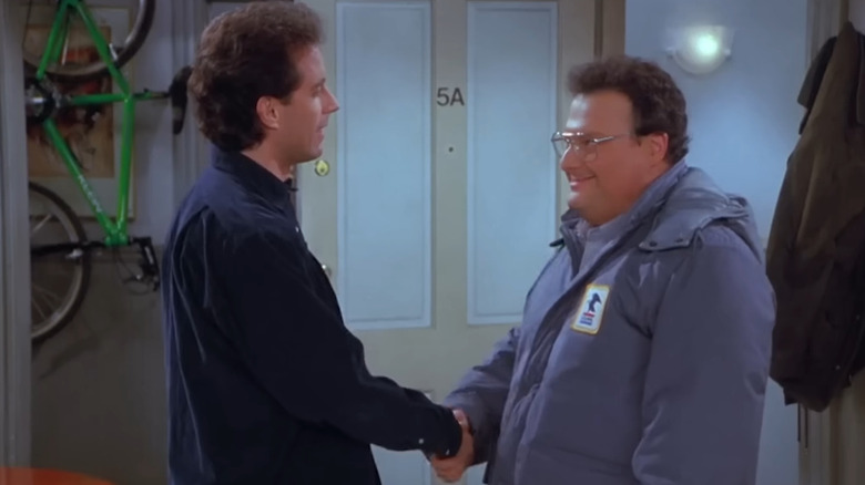 Newman and Jerry shake hands