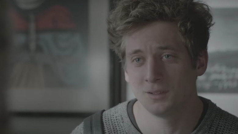 Lip Gallagher brow furrow