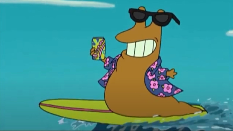 Slurms McKenzie on a surfboard