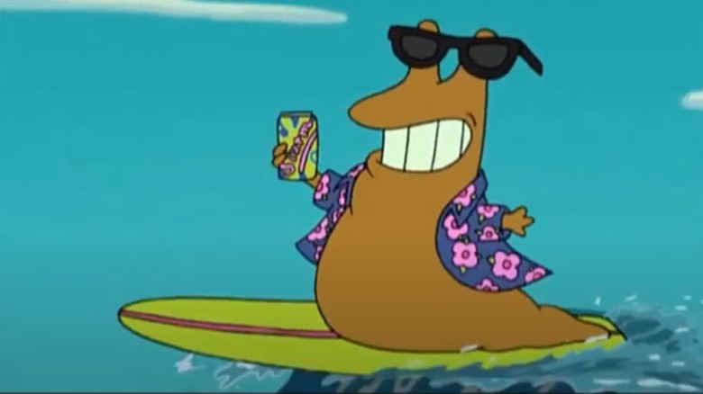 Slurms McKenzie on a surfboard