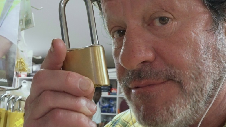 Javier holding up a padlock