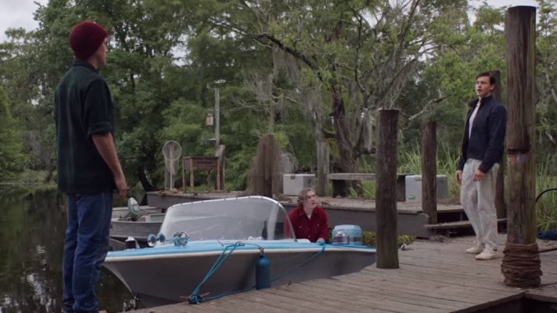 Tate and Chase speak on the dock