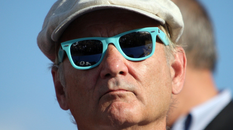 Bill Murray wearing shades and a cap