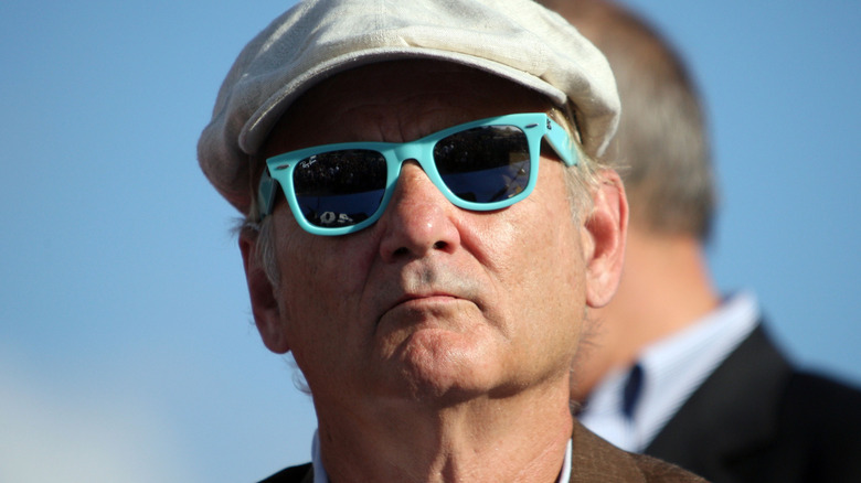 Bill Murray wearing shades and a cap