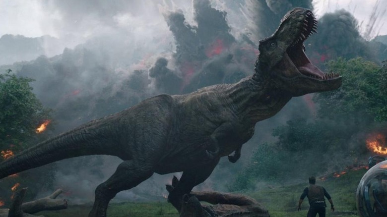 A T-Rex roars as a volcano consumes Isla Nublar in Jurassic World: Fallen Kingdom (2018_