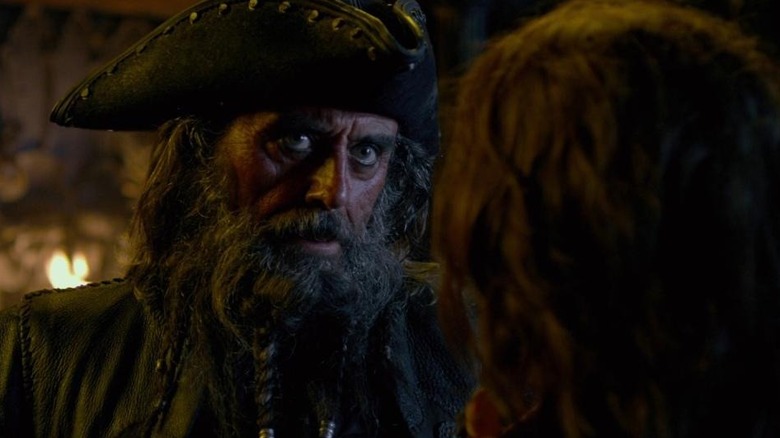 Blackbeard confronting a mouthy crew member in Pirates of the Caribbean: On Stranger Tides (2011)
