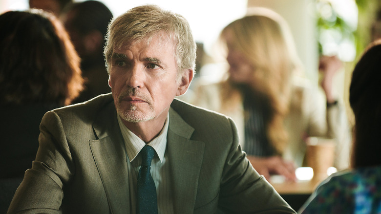 Billy McBride waits in a coffee shop in 'Goliath'