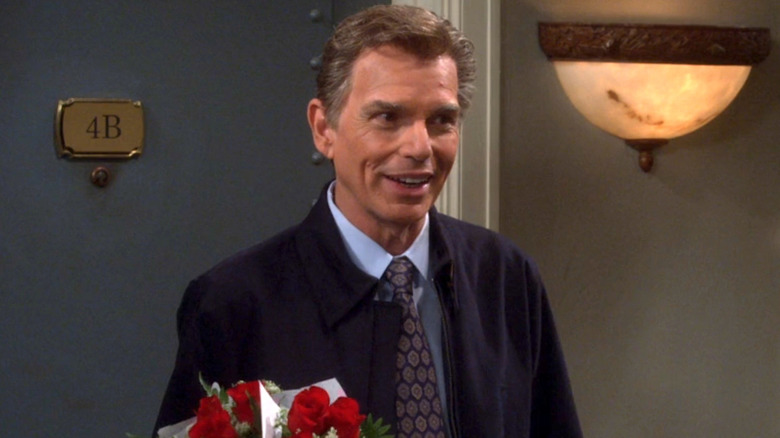 Dr. Lorvis holding flowers