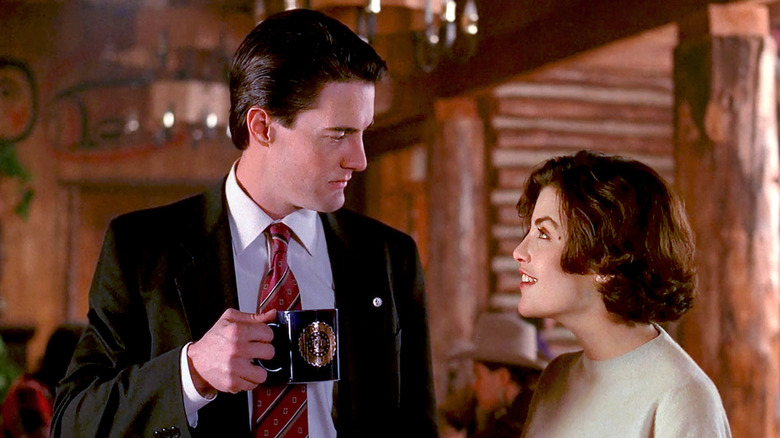 Cooper drinks coffee with Audrey in 