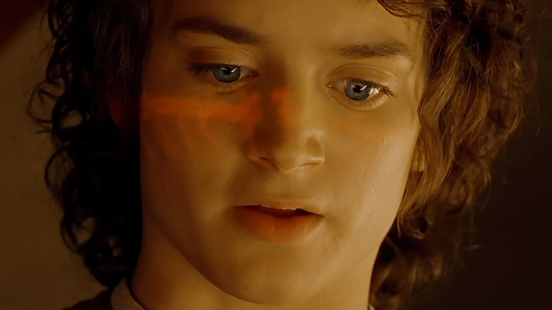 Frodo looks at the Ring