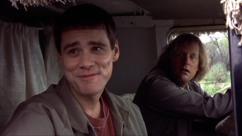 Harry and Lloyd peer out the window of their van