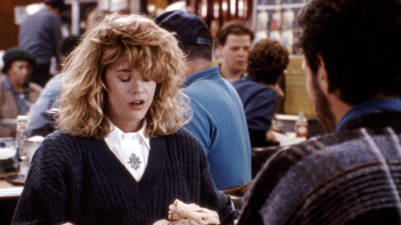 Sally looking overcome in a diner while Harry looks on