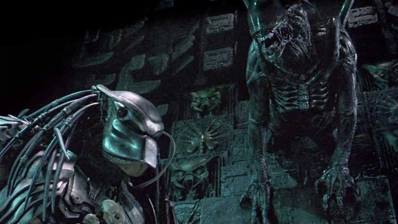 A xenomorph pounces on a Predator in an Antarctic pyramid
