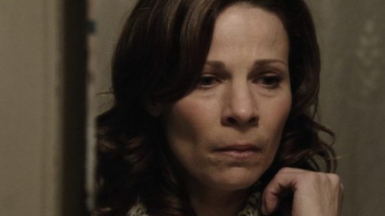 Lili Taylor clings to door