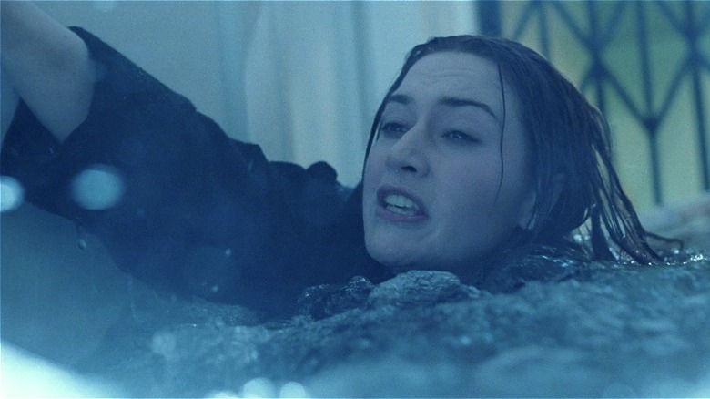 Kate Winslet reaching out of water