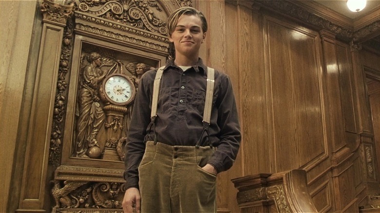 Leo smiles at top of the staircase