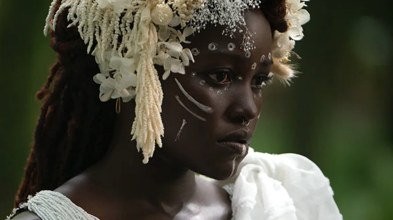 Nakia looks on in funeral garb