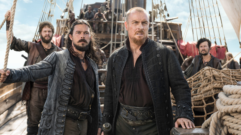 Captain Flint and Long John Silver on pirate ship