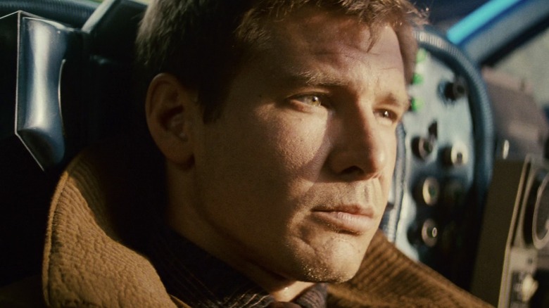 Deckard flying and squinting in sunlight