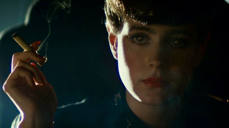 Rachael smoking and staring ahead