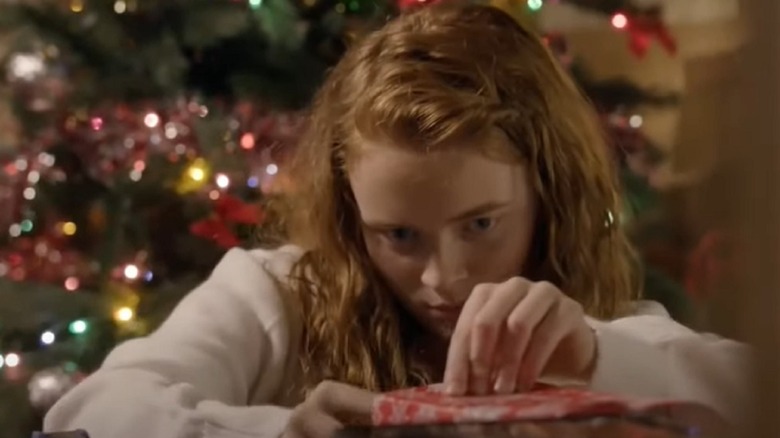 Sadie Sink wrapping Christmas gifts