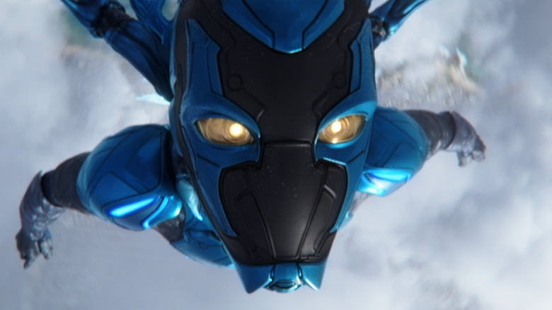 Blue Beetle flies above the clouds